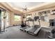 Comfortable gym area with treadmills, stationary bike, TV, and free weights at 29606 N Tatum Blvd # 204, Cave Creek, AZ 85331