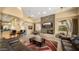 Spacious living room with fireplace and large screen TV create a cozy atmosphere for community gatherings at 29606 N Tatum Blvd # 204, Cave Creek, AZ 85331