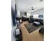Living room with hardwood floors, ceiling fan, modern furniture, and open concept layout at 29606 N Tatum Blvd # 204, Cave Creek, AZ 85331