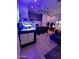 Bright and spacious living room with a large aquarium, custom lighting, and a bar area at 29606 N Tatum Blvd # 204, Cave Creek, AZ 85331