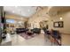 Comfortable community lounge area with a bar, plush seating, and elegant decor at 29606 N Tatum Blvd # 204, Cave Creek, AZ 85331