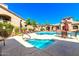 Terra Vista at Tatum Ranch offers a community pool with chairs, lounge seating and nearby shaded tables at 29606 N Tatum Blvd # 204, Cave Creek, AZ 85331