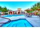 Community pool with lounge chairs, umbrellas, and a nearby clubhouse create a resort-like atmosphere at 29606 N Tatum Blvd # 204, Cave Creek, AZ 85331