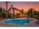 Backyard oasis featuring a pool and covered patio, perfect for entertaining guests at 3416 E Squawbush Pl, Phoenix, AZ 85044