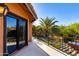 Balcony with stunning views of lush landscaping and clear blue skies at 3416 E Squawbush Pl, Phoenix, AZ 85044