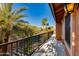 Balcony view with tropical palm trees and desert landscape at 3416 E Squawbush Pl, Phoenix, AZ 85044