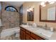 Bathroom featuring a double sink vanity and decorative tile accents at 3416 E Squawbush Pl, Phoenix, AZ 85044