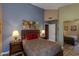 Cozy bedroom with blue walls, warm lighting, and a comfortable bed at 3416 E Squawbush Pl, Phoenix, AZ 85044