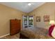 Inviting bedroom with vaulted ceilings and a large dresser at 3416 E Squawbush Pl, Phoenix, AZ 85044