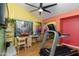 Bright exercise room featuring vaulted ceilings, vibrant colors, and a modern treadmill at 3416 E Squawbush Pl, Phoenix, AZ 85044