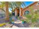 Charming home featuring a flagstone walkway, potted flowers, desert landscaping, and an inviting facade at 3416 E Squawbush Pl, Phoenix, AZ 85044