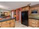 Open kitchen featuring granite countertops, stainless steel appliances, and custom wood cabinets at 3416 E Squawbush Pl, Phoenix, AZ 85044