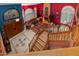 Spacious living room with colorful walls, a fireplace, tile floor, and an open staircase at 3416 E Squawbush Pl, Phoenix, AZ 85044