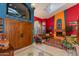 Bright living room showcasing colorful walls, a fireplace, stylish furniture, and unique decor at 3416 E Squawbush Pl, Phoenix, AZ 85044