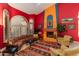 Cozy living room with a fireplace, large windows, and comfortable seating arrangement on tile floors at 3416 E Squawbush Pl, Phoenix, AZ 85044