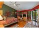 Bright main bedroom with a fireplace, balcony access, and a relaxing seating area at 3416 E Squawbush Pl, Phoenix, AZ 85044