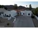 Beautiful white stucco home featuring a red tile roof and attached garages at 3738 E Kachina Dr, Phoenix, AZ 85044