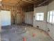 Picture of a kitchen space under construction with exposed framing, updated flooring, and a single window at 3738 E Kachina Dr, Phoenix, AZ 85044