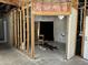Exposed room under construction with framing, an animal print rug, and stained glass window at 3738 E Kachina Dr, Phoenix, AZ 85044