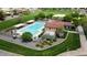 Aerial view of the community pool, lawn, and sitting area at 42468 W Palmyra Ct, Maricopa, AZ 85138