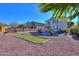 Home's backyard featuring a pool and landscaping at 42468 W Palmyra Ct, Maricopa, AZ 85138