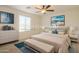 Modern bedroom with neutral tones and a window view at 42468 W Palmyra Ct, Maricopa, AZ 85138