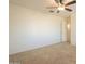 Simple carpeted bedroom awaiting personalization at 42468 W Palmyra Ct, Maricopa, AZ 85138
