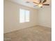 Bedroom with window, ceiling fan, and carpet at 42468 W Palmyra Ct, Maricopa, AZ 85138