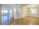 Spacious living area featuring neutral walls, tan tile flooring and recessed lighting at 42468 W Palmyra Ct, Maricopa, AZ 85138