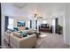 Bright, staged living room with neutral colors and modern furnishings at 42468 W Palmyra Ct, Maricopa, AZ 85138