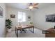 Home office featuring a desk, window, and stylish decorations at 42468 W Palmyra Ct, Maricopa, AZ 85138