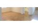Open area showcasing tan tile flooring, a doorway, and neutral paint at 42468 W Palmyra Ct, Maricopa, AZ 85138