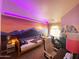 Unique bedroom with sunset mural, ambient lighting, and a dedicated workspace at 4805 E Kachina Trl # 25, Phoenix, AZ 85044