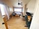 Bright bedroom with large windows, ceiling fan, and hardwood floors at 4805 E Kachina Trl # 25, Phoenix, AZ 85044