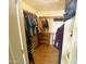 Walk-in closet offering ample storage space with shelving and hanging rods at 4805 E Kachina Trl # 25, Phoenix, AZ 85044