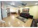 Open-concept living room with hardwood floors and a neutral-colored rug at 4805 E Kachina Trl # 25, Phoenix, AZ 85044