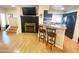 Cozy living room with hardwood floors and modern electric fireplace insert at 4805 E Kachina Trl # 25, Phoenix, AZ 85044