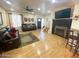 Inviting living room features hardwood floors, fireplace, and comfortable leather sofas at 4805 E Kachina Trl # 25, Phoenix, AZ 85044