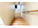 Wooden staircase leading to the lower level, complemented by a handrail at 4805 E Kachina Trl # 25, Phoenix, AZ 85044