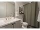 Bathroom featuring a vanity with a sink, toilet, and bathtub with a shower curtain at 4925 S Turbine --, Mesa, AZ 85212