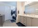Bright bathroom features patterned tile floor, shower-tub combo and large vanity with double sinks at 4925 S Turbine --, Mesa, AZ 85212