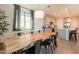 Dining area with modern table is conveniently located adjacent to the kitchen, great for gatherings and meals at 4925 S Turbine --, Mesa, AZ 85212