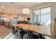 Open dining area with modern table, seamlessly connected to the kitchen and outdoor space at 4925 S Turbine --, Mesa, AZ 85212