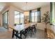 The well-lit dining area flows to the patio and the kitchen, creating an inviting space at 4925 S Turbine --, Mesa, AZ 85212