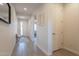 Inviting foyer featuring neutral walls, wood floors, and a view of the front door at 4925 S Turbine --, Mesa, AZ 85212