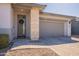 Attractive home featuring stone accents, a two-car garage, and a welcoming front entrance at 4925 S Turbine --, Mesa, AZ 85212