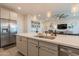 Beautiful open kitchen featuring a large island, stainless steel appliances, and seamless flow to the living area at 4925 S Turbine --, Mesa, AZ 85212
