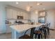 Bright kitchen features stainless appliances, a large island, and modern pendant lighting at 4925 S Turbine --, Mesa, AZ 85212