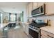Modern kitchen boasts stainless steel appliances and a convenient layout, perfect for cooking and meal preparation at 4925 S Turbine --, Mesa, AZ 85212