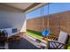 Covered patio featuring outdoor furniture, swing and artificial turf at 4925 S Turbine --, Mesa, AZ 85212